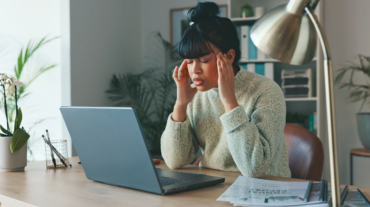 Headache, stress and burnout for woman with laptop and anxiety over writers block for social media content writing. Mental health, pain and brain fatigue for digital online news home remote worker.